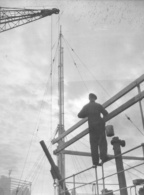 This image has been taken from the Joseph L Thompson & Sons Ltd shipbuilders’ collection. A painter working on a super structure at J L Thompson & Sons